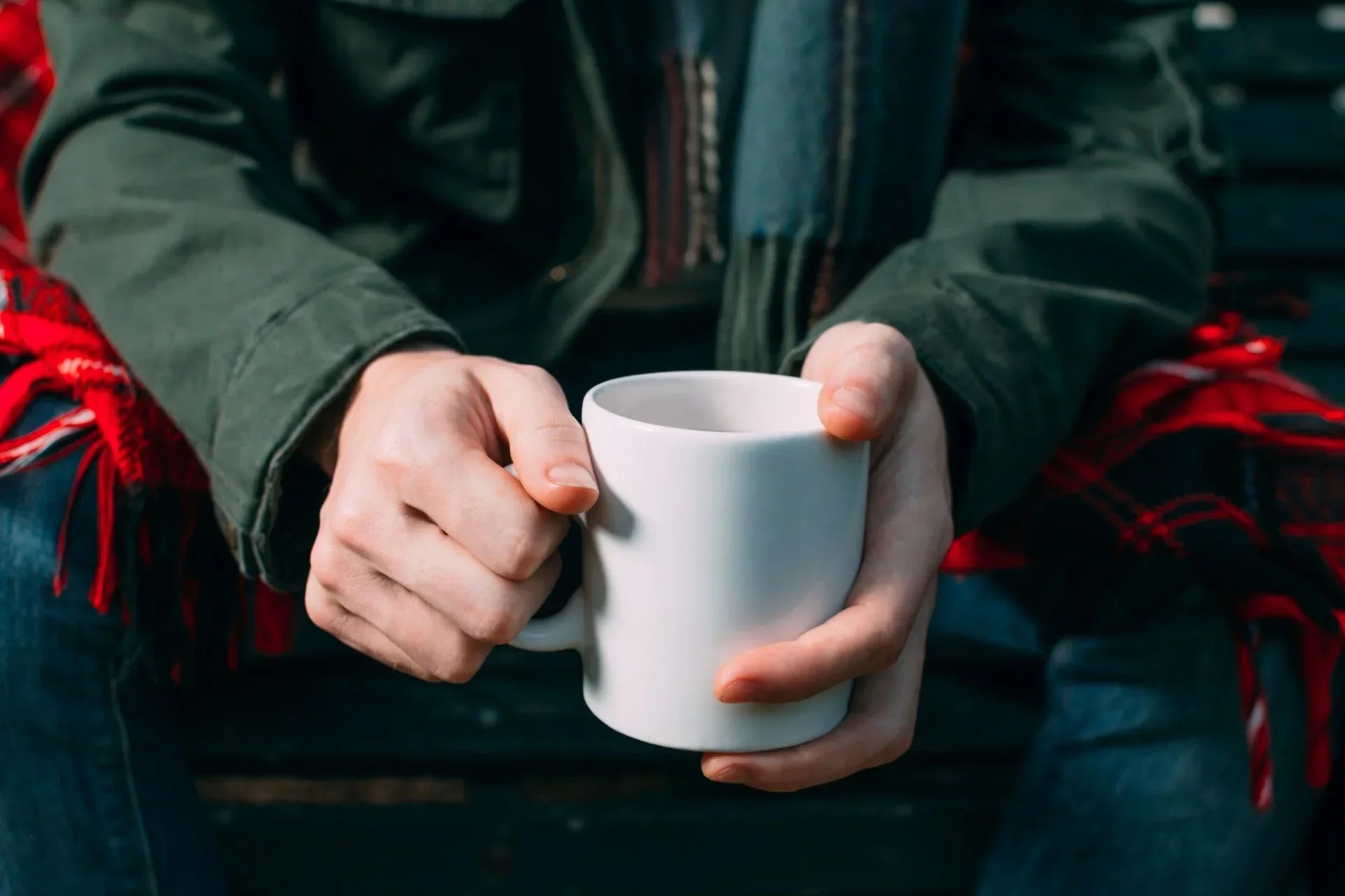 A man holding a oversized mug